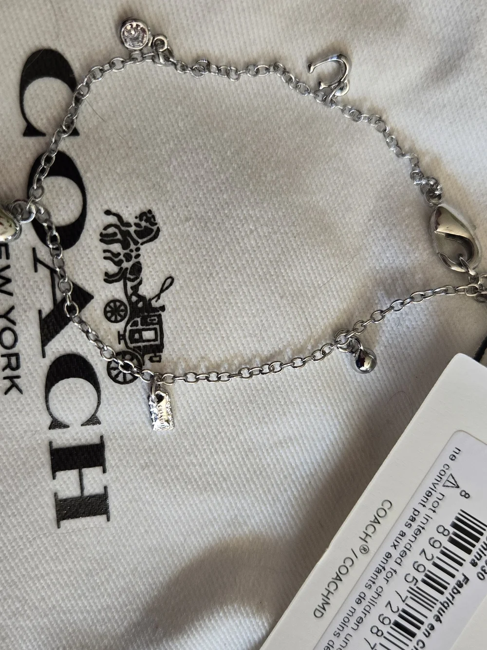 Coach Silver Charm Bracelet with Heart Accents